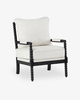 A Pinedale Spindle Spool Chenille Armchair with a beige cushion and dark wooden frame, against a white background.