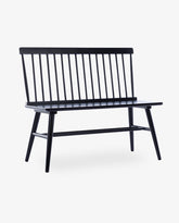 A black Kissimmee spindle love seat wood bench with a slatted backrest and solid seat