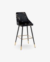 A black bar stool with a square footrest