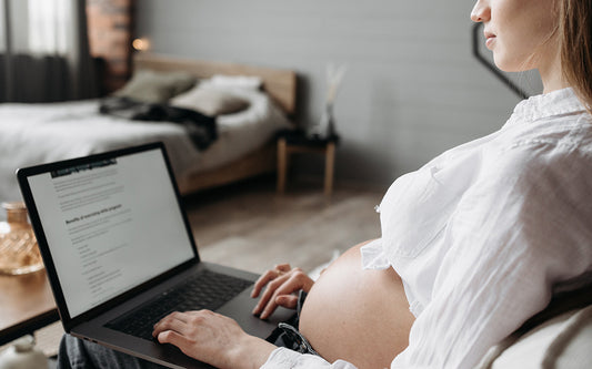 pregnant woman working with a laptop