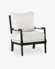 A Pinedale Spindle Spool Chenille Armchair with a beige cushion and dark wooden frame, against a white background.